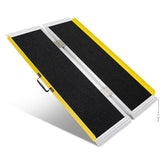 4-foot portable folding wheelchair ramp with a black non-slip surface, yellow raised edges, aluminum frame, center hinges, and carrying handle on a white background.