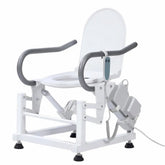 Dual-motor electric toilet lift seat with a white steel frame, padded armrests, open toilet lid, two lifting actuators, and wired handheld controller.