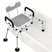 Gray adjustable swivel tub transfer bench positioned across a bathtub, with padded armrests, drainage holes, aluminum frame, and non-slip feet.