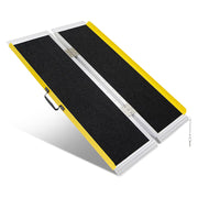 4-foot portable folding wheelchair ramp with a black non-slip surface, yellow raised edges, aluminum frame, center hinges, and carrying handle on a white background.