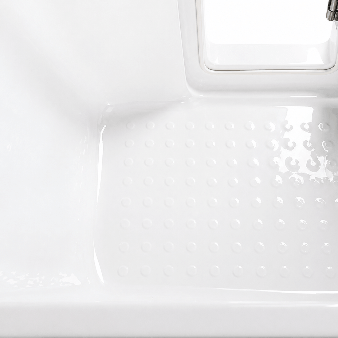 Textured non-slip floor inside the 60 in. deep soaking walk-in bathtub
