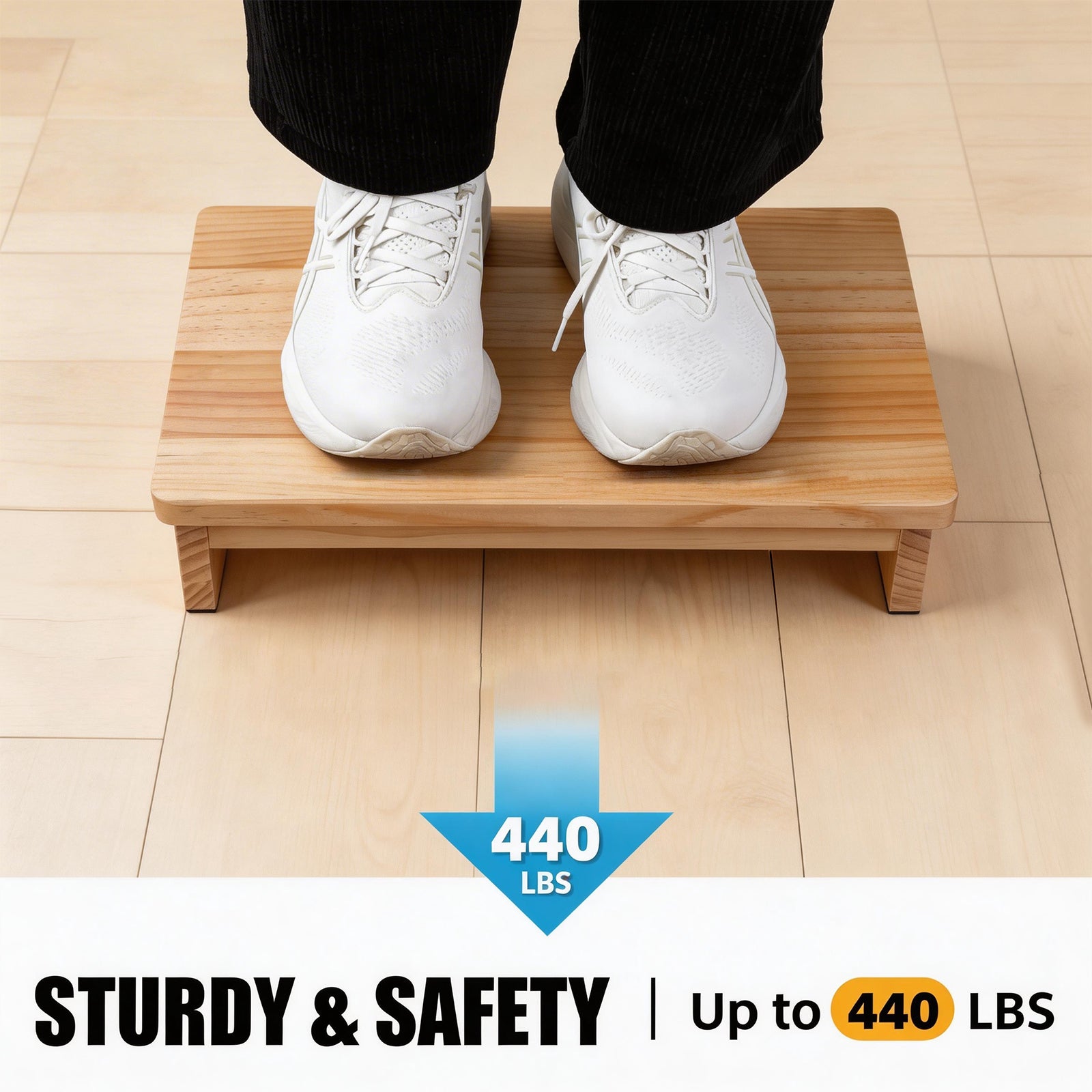 Person standing on a wooden half-step stool, with a graphic stating a maximum weight capacity of 440 lb.