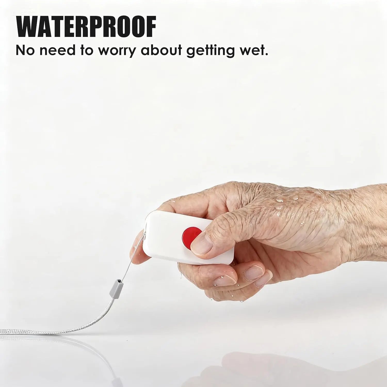 Water-resistant senior SOS call button held in a hand, showing the red emergency button, attached lanyard, and water droplets.