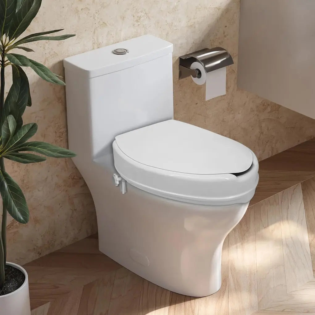 White raised toilet seat with lid installed on a toilet in a bathroom, shown with the lid closed and the side locking bracket visible.