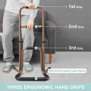 Three-level grip guide for the portable stand assist, showing a person holding the upper and middle handles beside a sofa, with labels for all three foam-padded grips.
