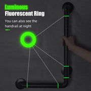 Black L-shaped bathroom grab bar shown in a dark setting, with green luminous rings highlighted along the vertical and horizontal rails.