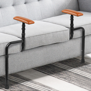 Adjustable sofa standing assist rails installed on a gray couch, with black metal supports and brown padded armrests positioned on both sides of the seat.