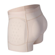 Beige hip protector underwear shown from the side, highlighting the perforated hip protection pad, contoured front panel, and wide waistband.